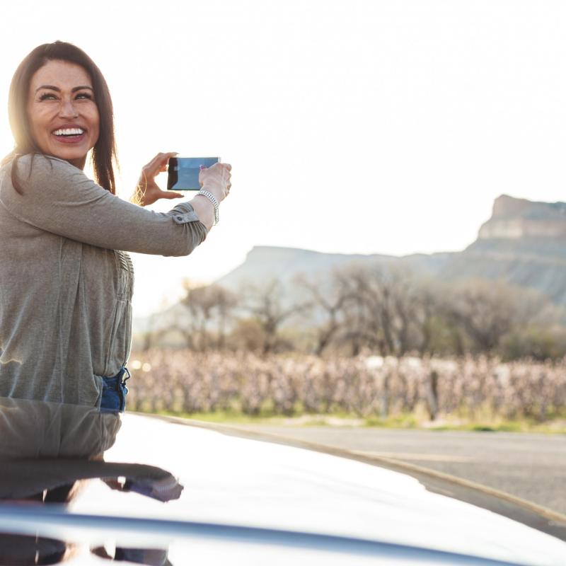 a person riding a skateboard up the side of a road