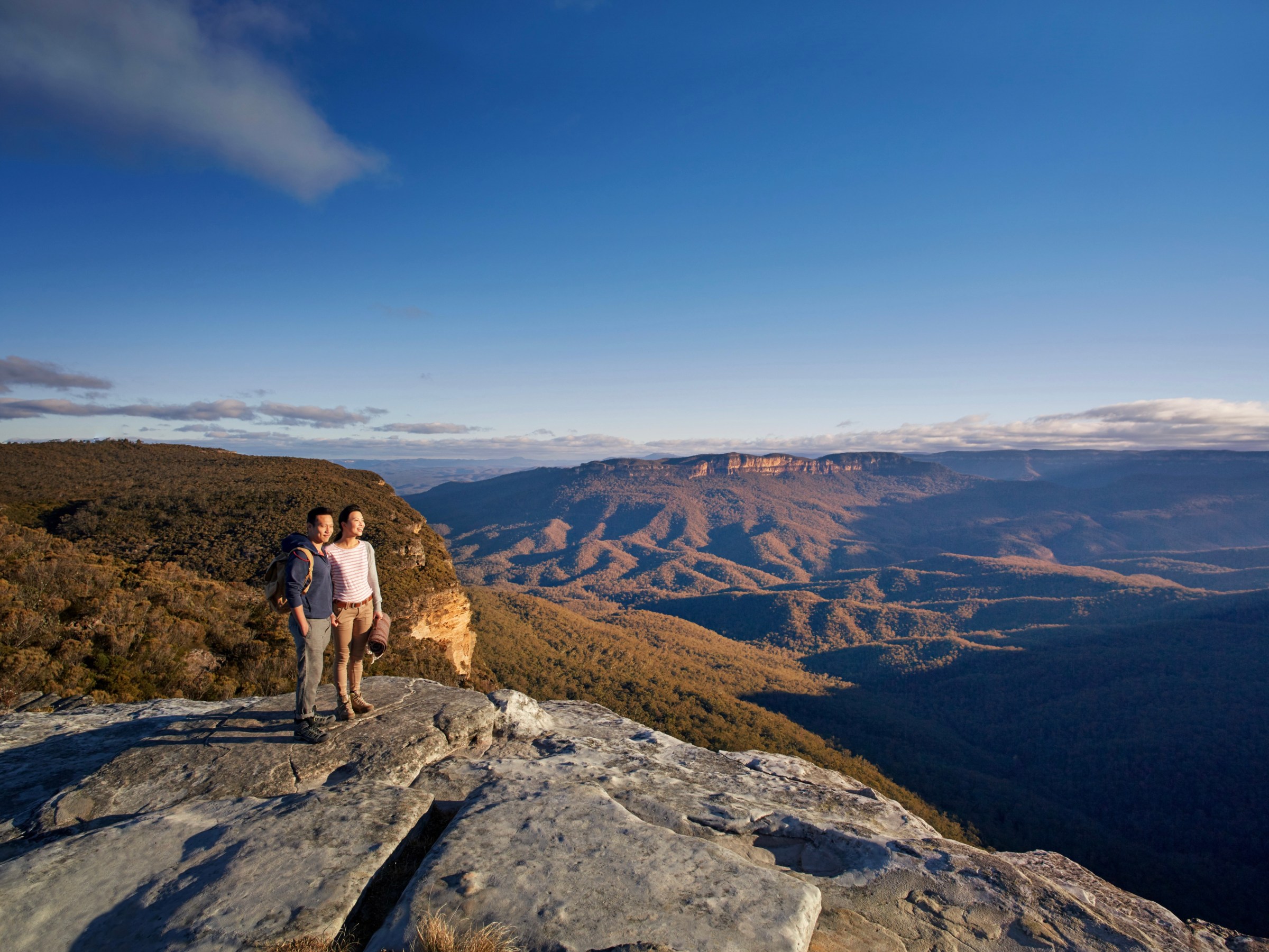 a man standing on top of a mountain