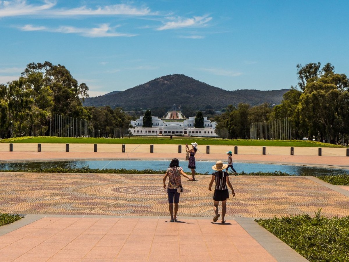 a group of people walking in a park