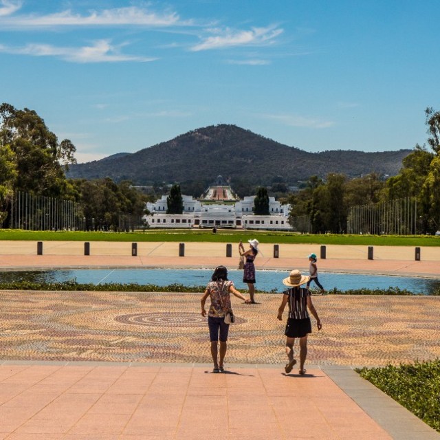 a group of people walking in a park