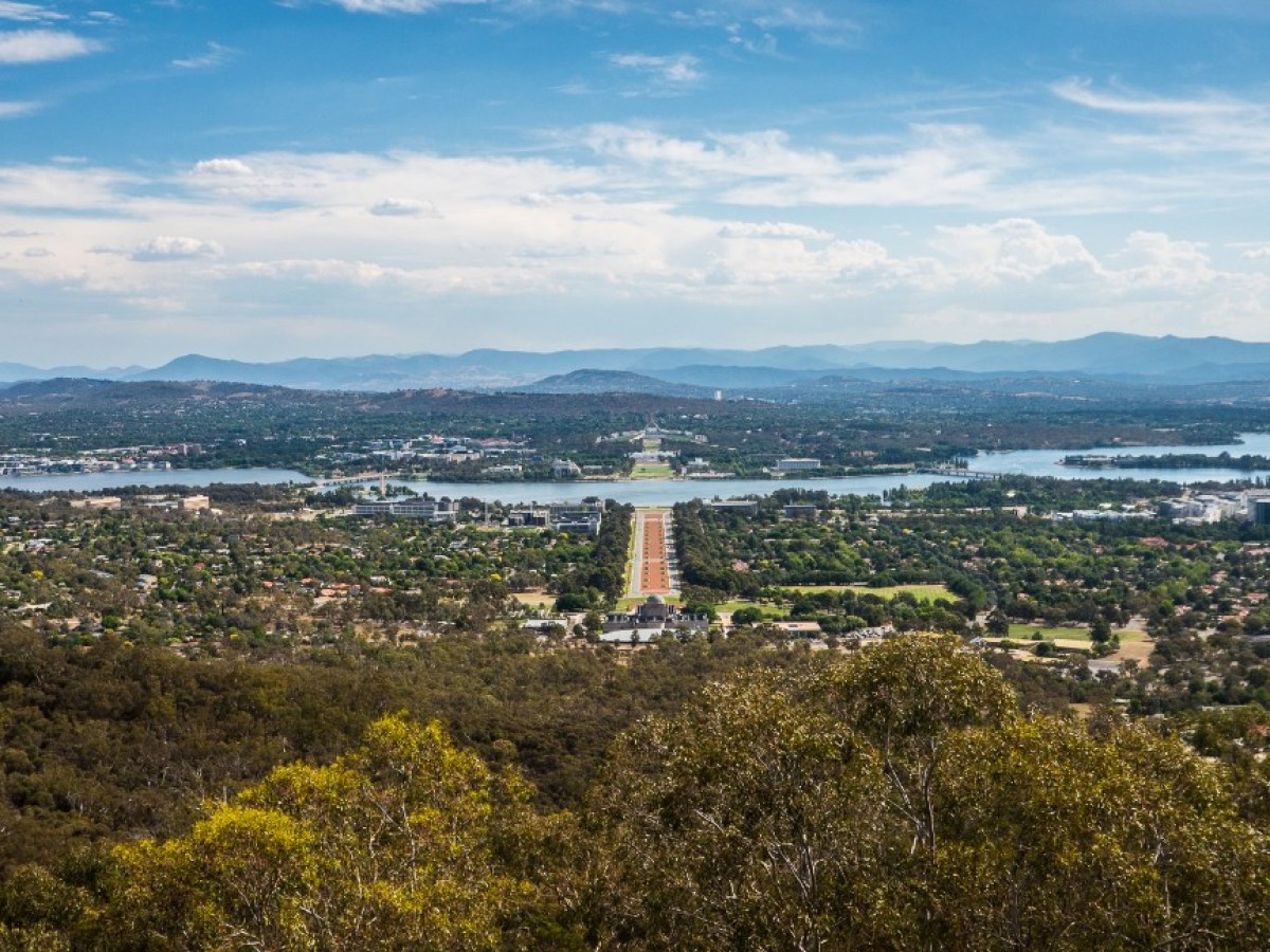 a large body of water with a city in the background